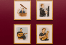 Four framed paintings of musicians playing instruments on a red wall.